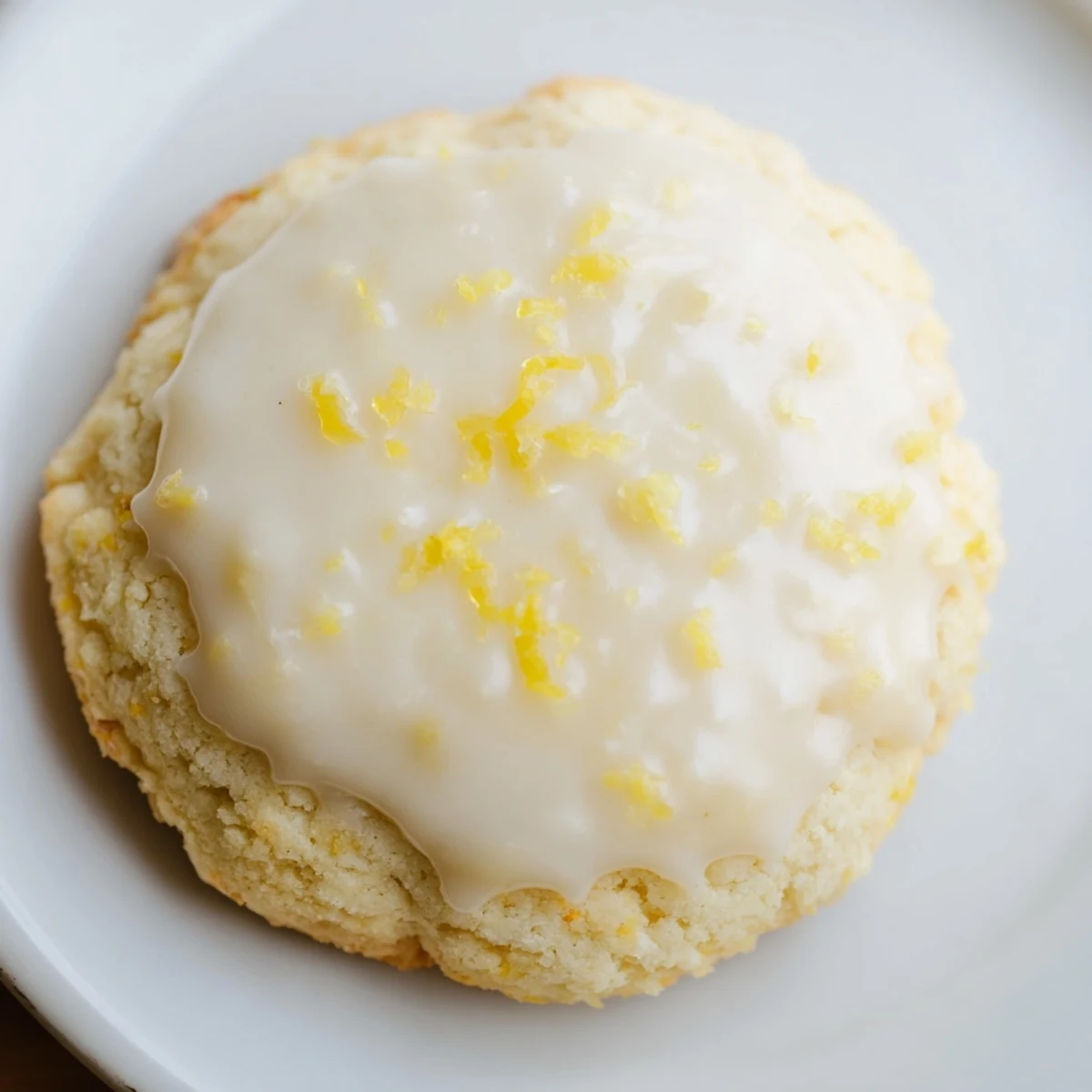 Freshly baked Lemon Ricotta Cookies with Glaze arranged on a wire rack, their golden edges and glossy glaze catching the light.