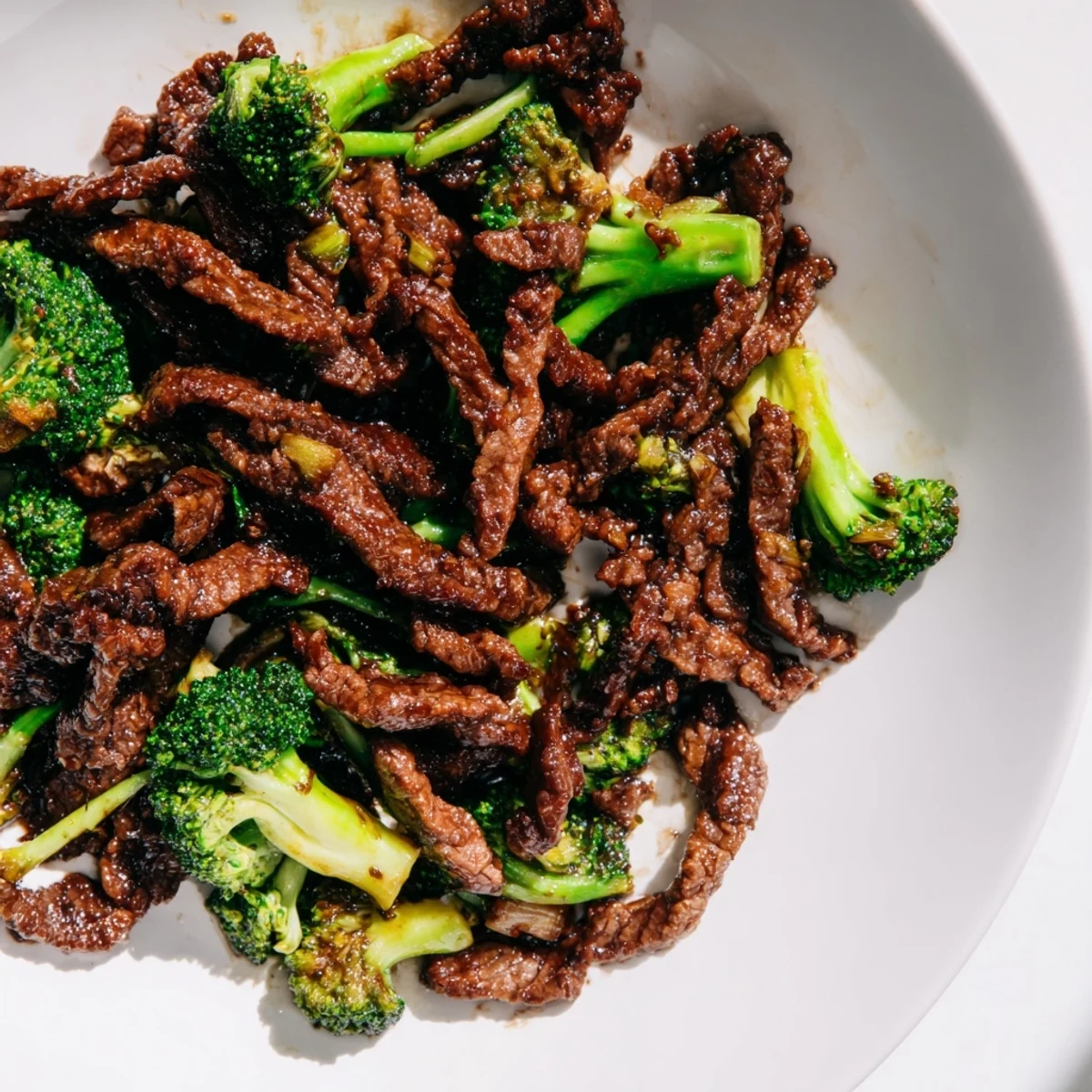 Bright green broccoli florets and tender beef strips coated in savory Asian-inspired sauce.  