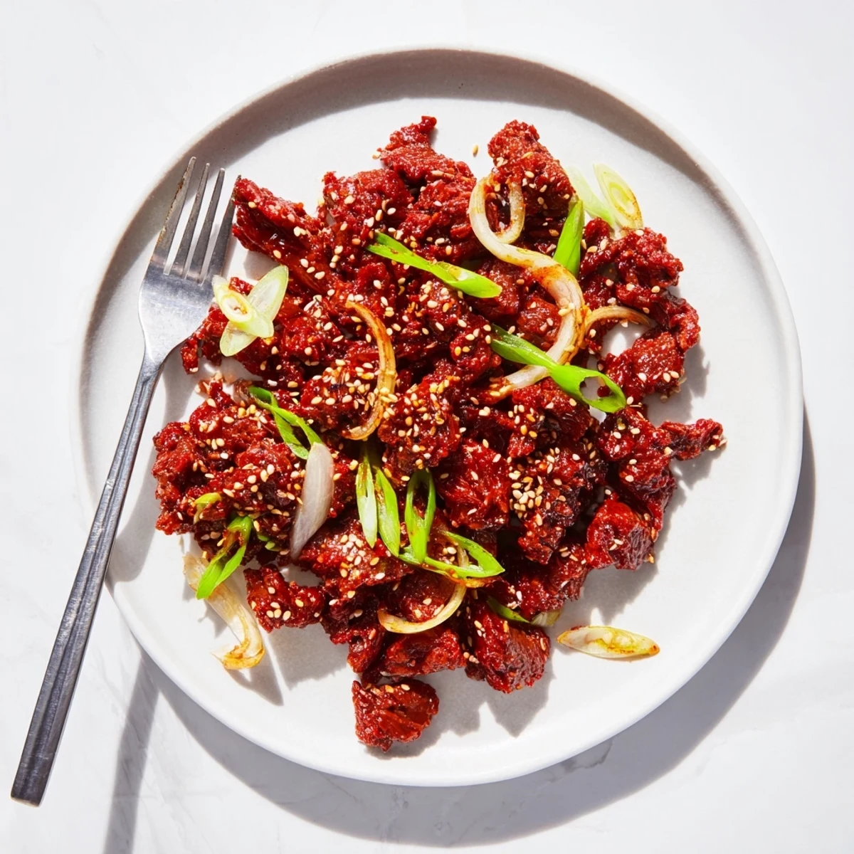 Savory slow cooker Korean beef served in crisp lettuce wraps with kimchi