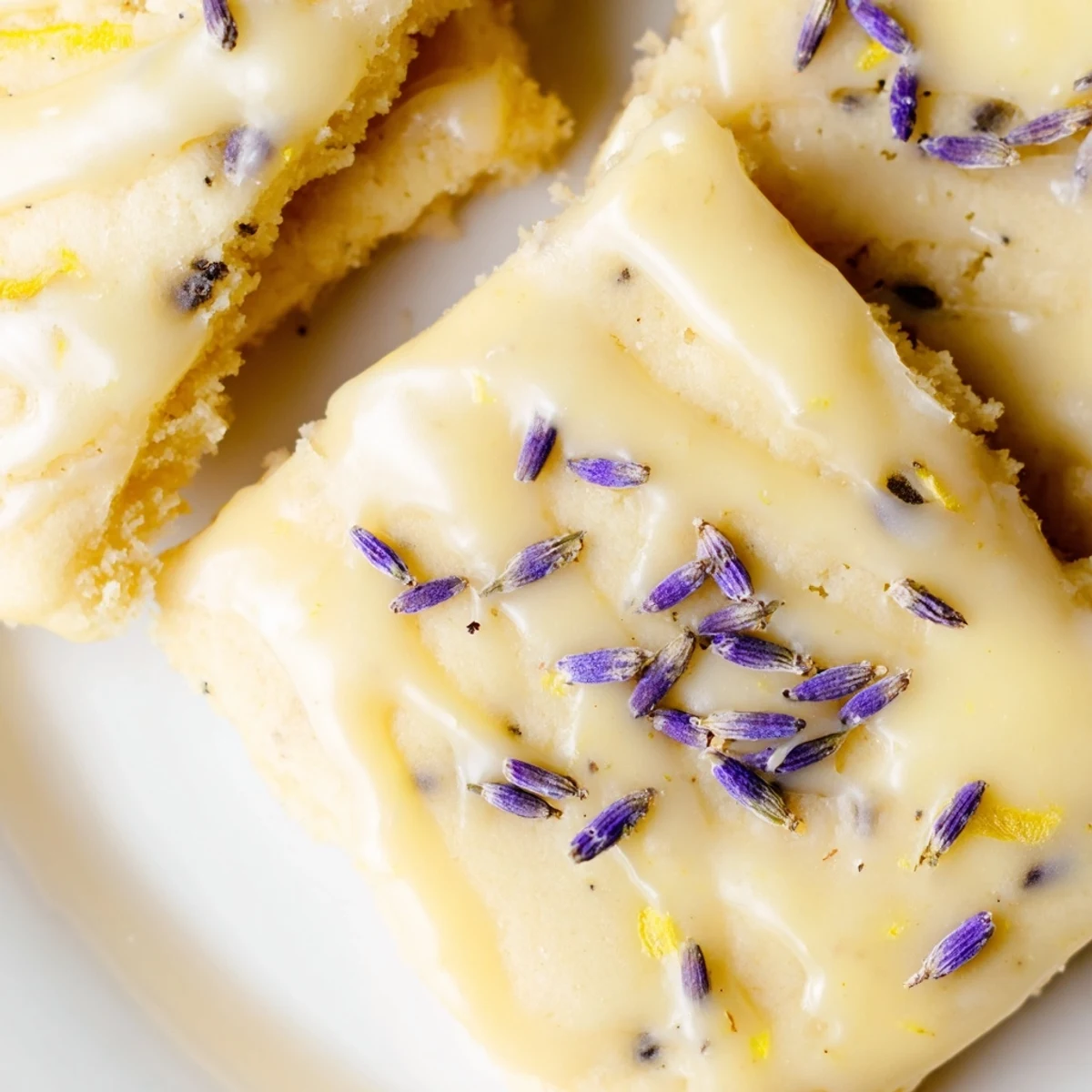 Buttery Iced Lemon Lavender Shortbread Cookies with golden edges and delicate lavender flecks throughout