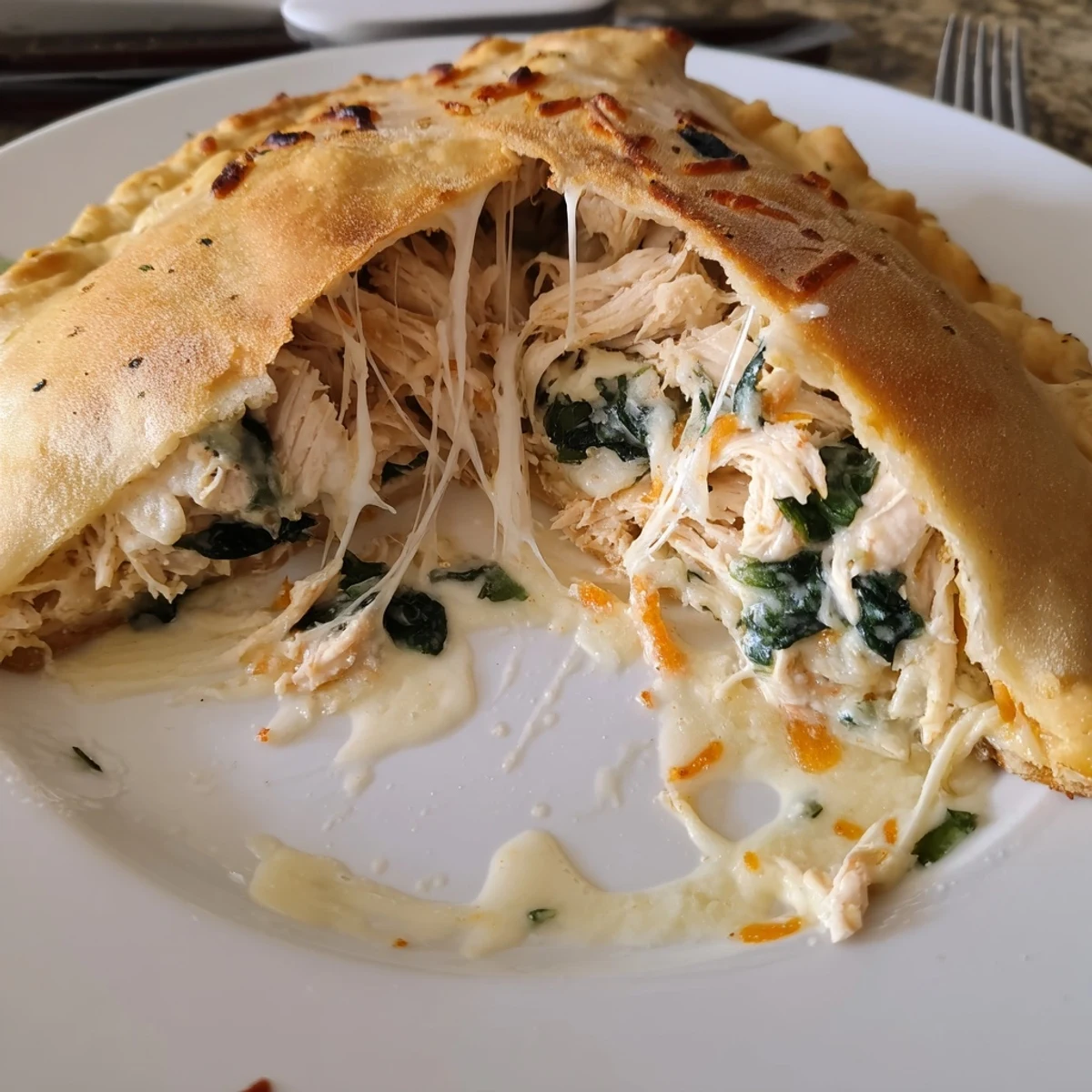 Golden Crispy Cheesy Chicken Alfredo Air Fryer Calzones, steam rising, cheesy pull