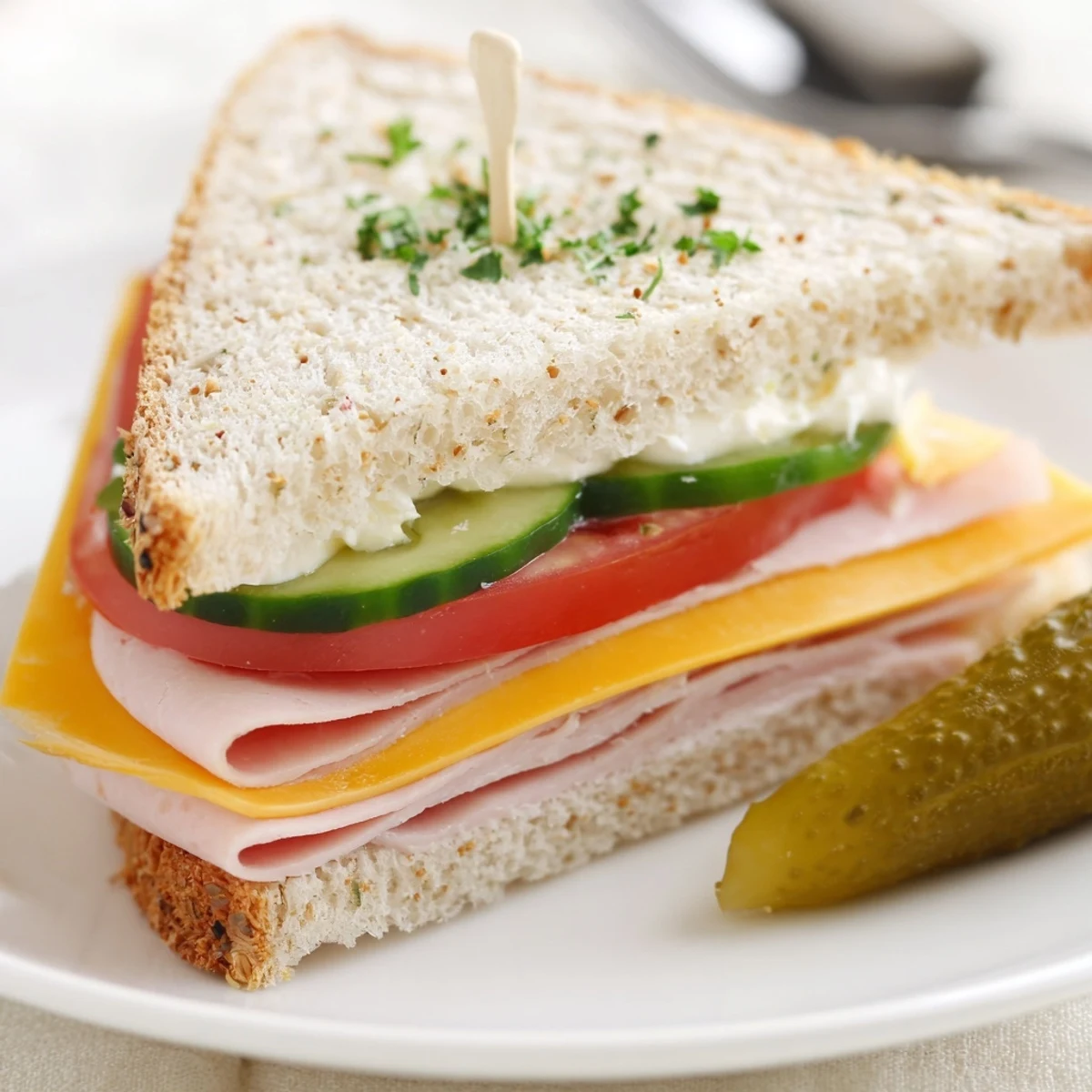 Stacked Mini Sandwiches cut into triangles, perfect for picnics or parties
