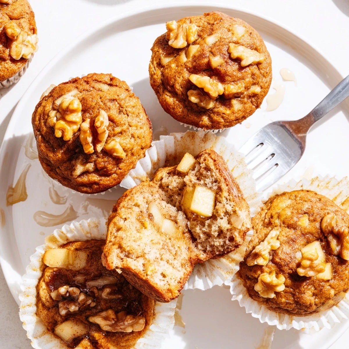 Plate of Healthy Apple Cinnamon Greek Yogurt Muffins, juicy apple chunks visible