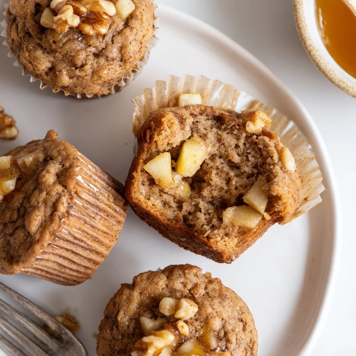 Freshly baked Healthy Apple Cinnamon Greek Yogurt Muffins, best served warm with honey