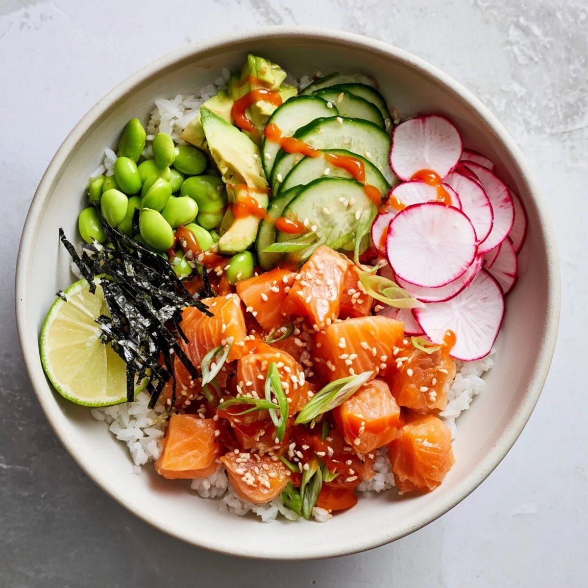 Hawaiian-inspired salmon poke bowl topped with creamy avocado and crispy vegetables