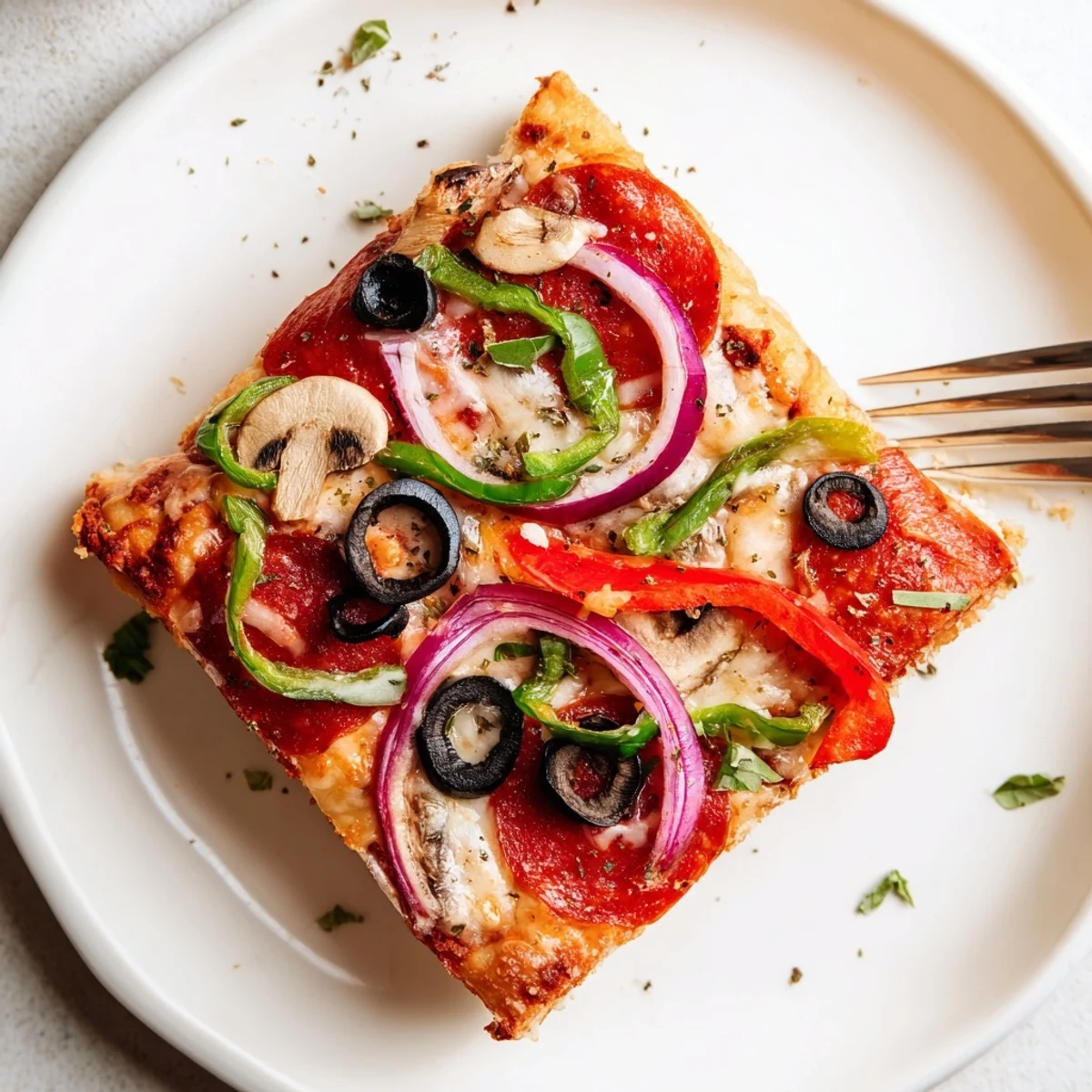 Warm Focaccia Pizza Supreme drizzled with olive oil, topped with fragrant basil