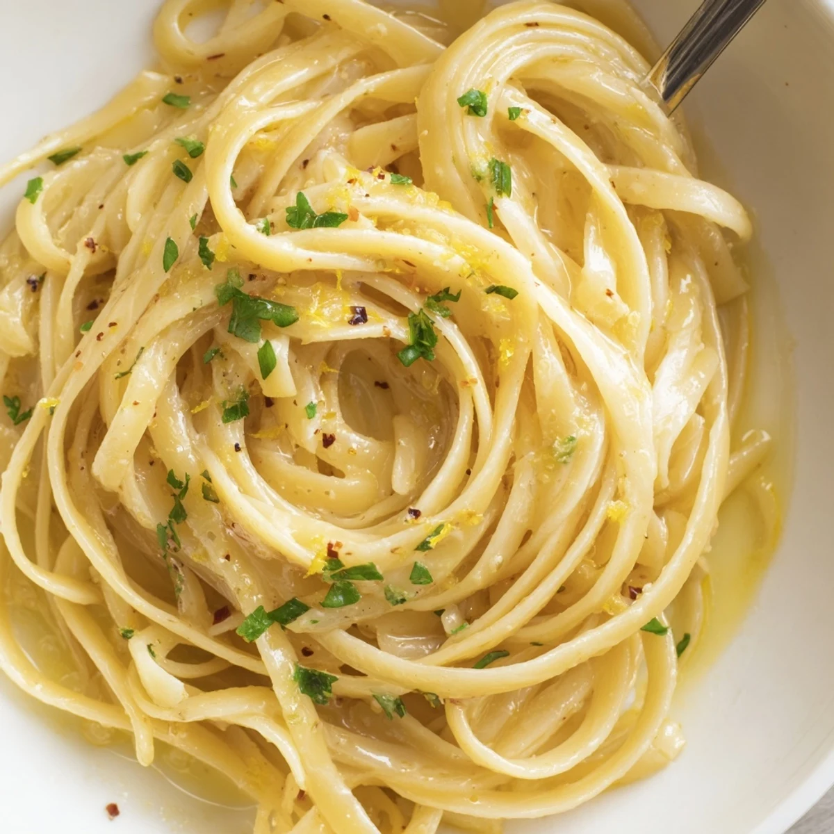 Creamy Cowboy Butter Pasta steaming on plate, lemon wedge and parmesan  